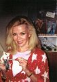 Deanna Lund with miniature Land of the Giants Mark Wilson figure
