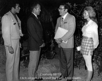 Don Marshall, Gordon Cooper, Irwin Allen and Deanna Lund on the set of Land of the Giants